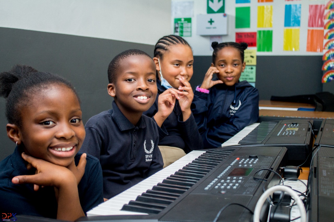 Group of kids on a piano